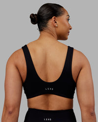 Woman wearing Reform Sports Bra - Black | Model:Ayla | Size:S