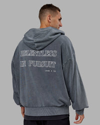Man wearing Relentless Washed Zip Through Oversized Hoodie - Dark Storm-White | Model:Tommy | Size:S