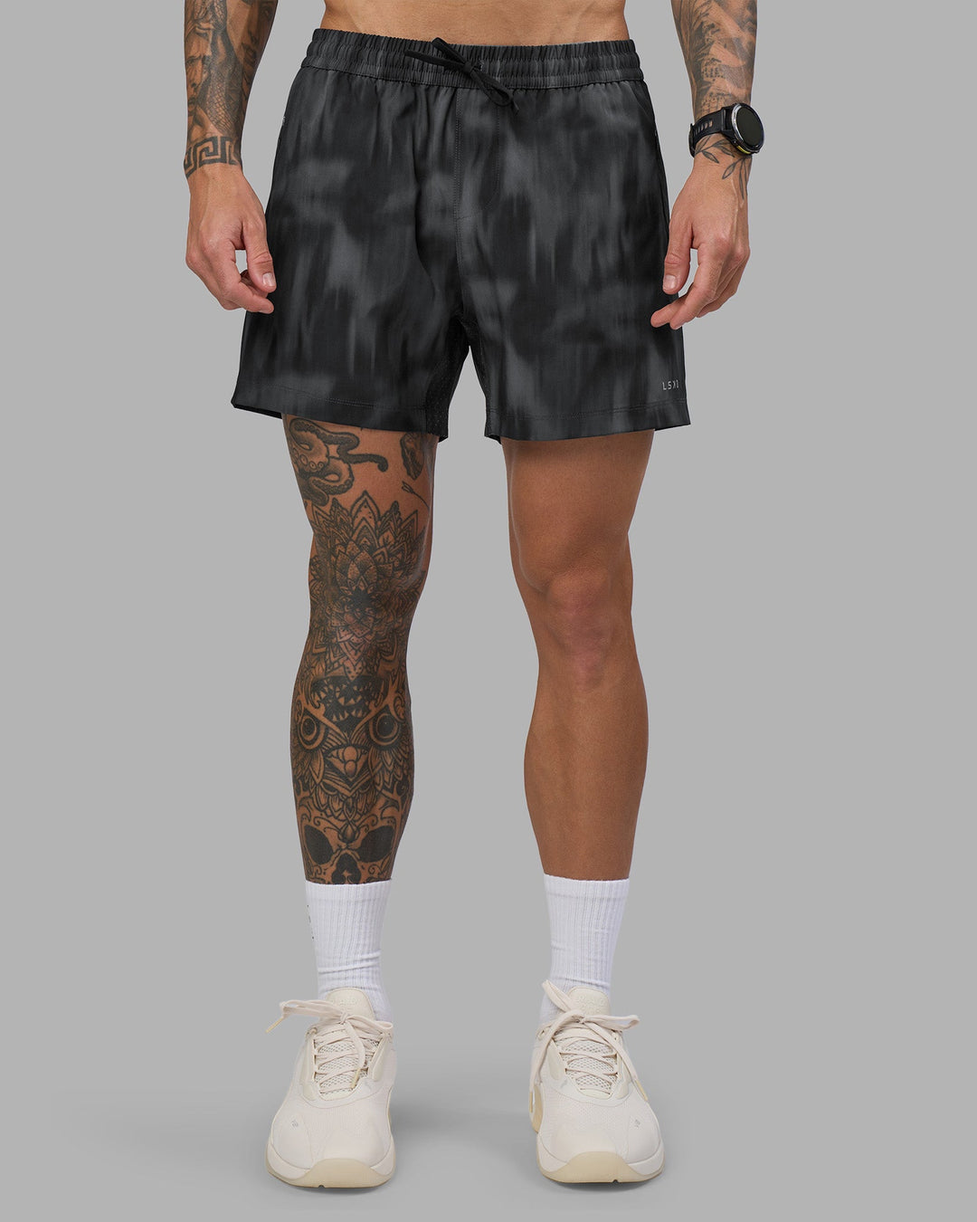 Man wearing Rep 5" Performance Short - Lunar Glow Print | Model:Tommy | Size:S