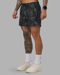 Man wearing Rep 5" Performance Short - Lunar Glow Print | Model:Tommy | Size:S