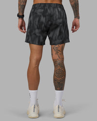 Man wearing Rep 5" Performance Short - Lunar Glow Print | Model:Tommy | Size:S