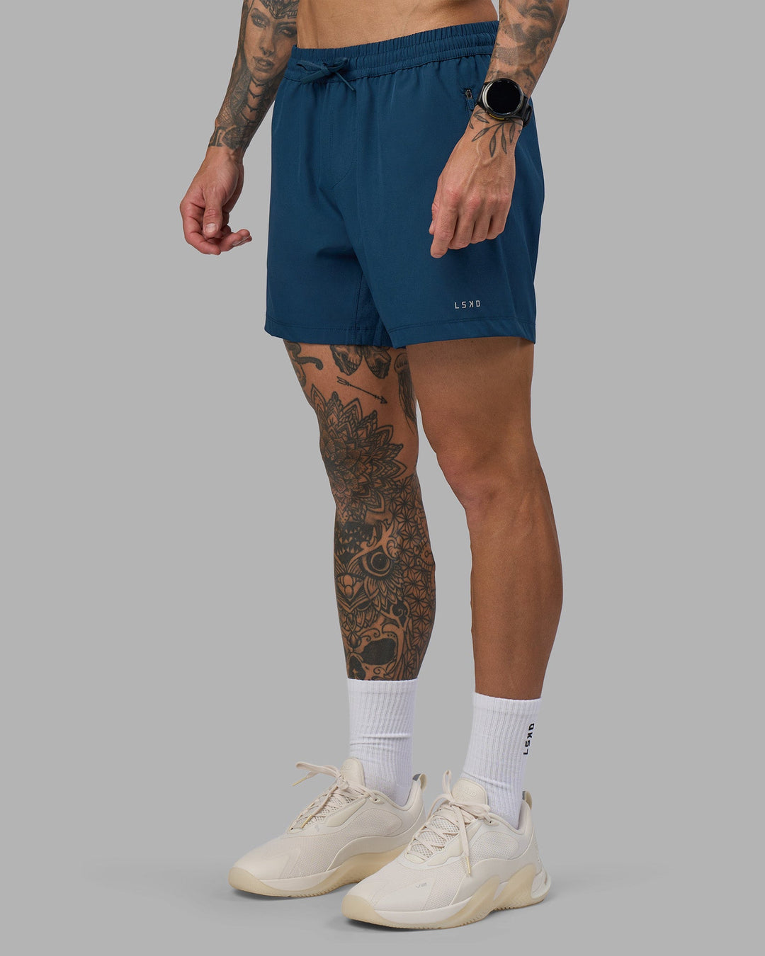 Man wearing Rep 5&quot; Performance Short - Night Sea | Model:Tommy | Size:S