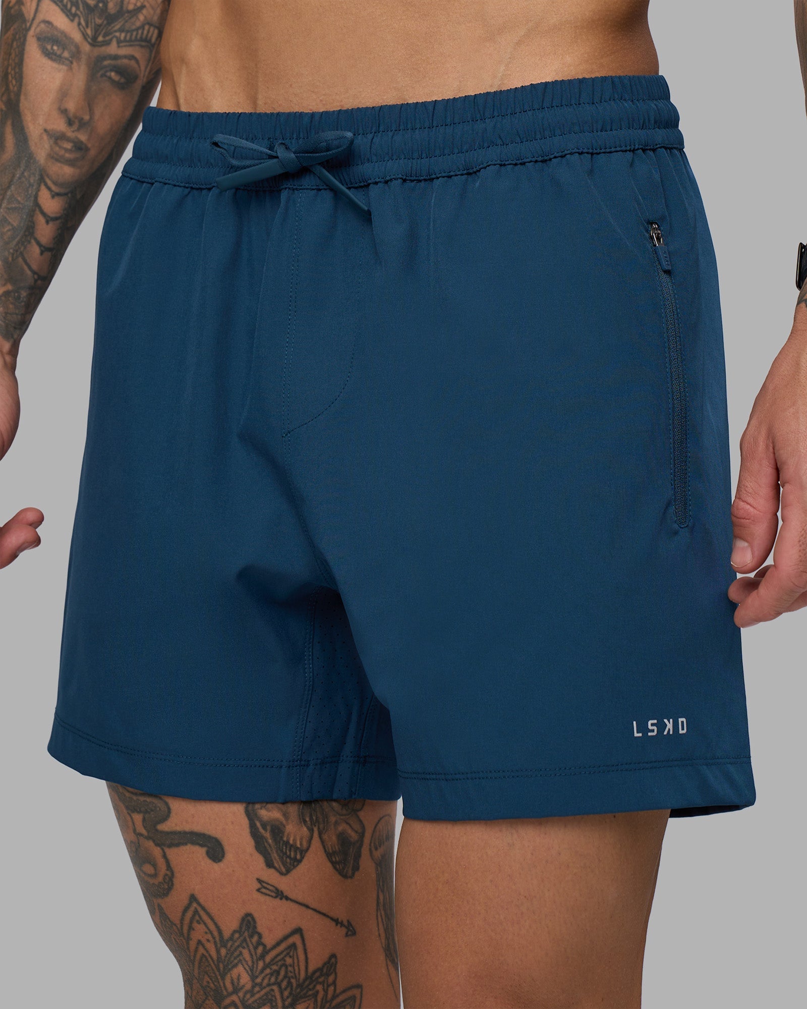 Man wearing Rep 5" Performance Short - Night Sea | Model:Tommy | Size:S