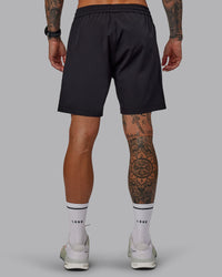 Man wearing Rep 7'' Performance Short in Black-White | Size:S