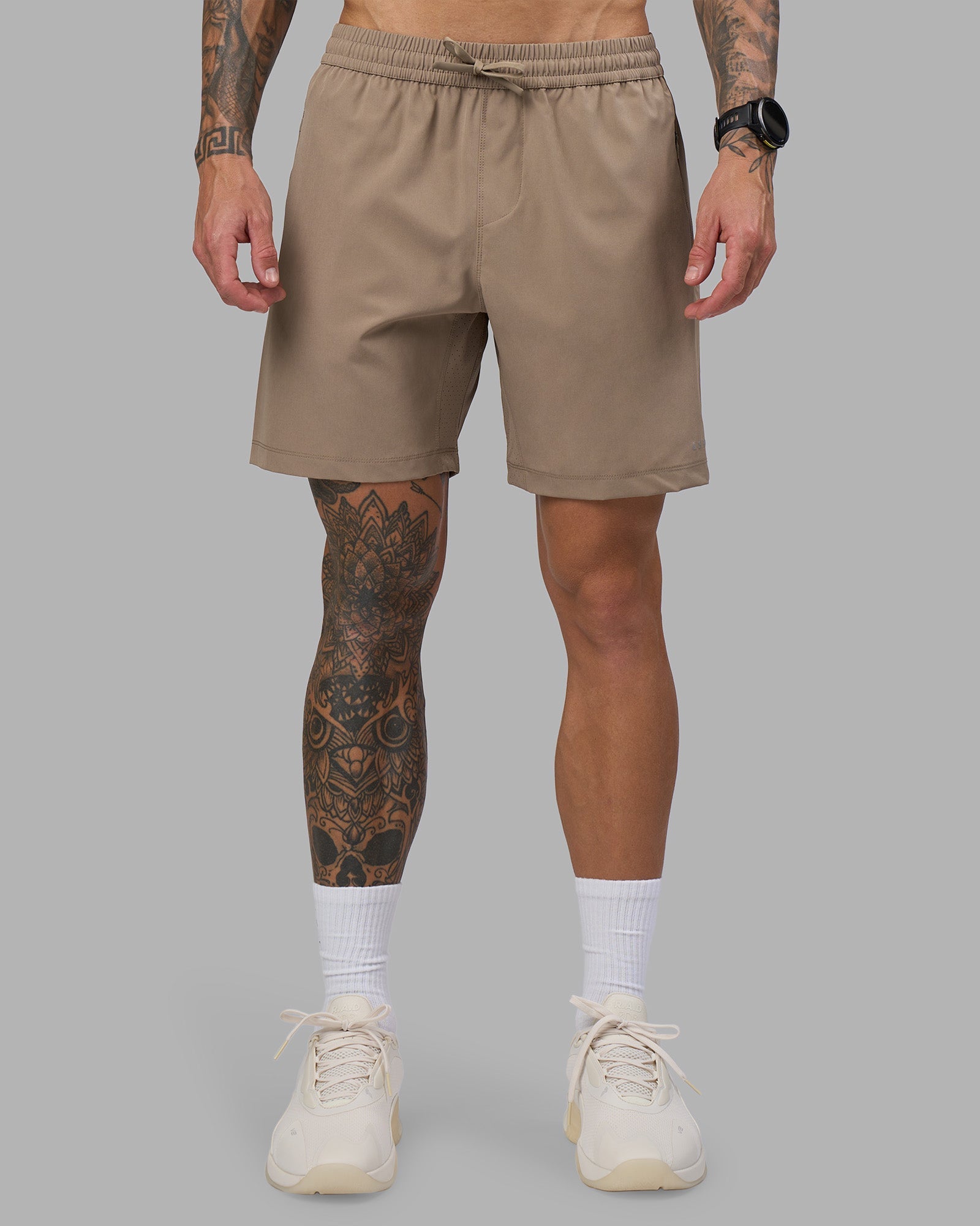 Man wearing Rep 7'' Performance Short - Greige | Model:Tommy | Size:S