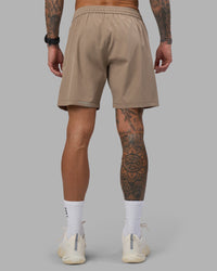 Man wearing Rep 7'' Performance Short - Greige | Model:Tommy | Size:S
