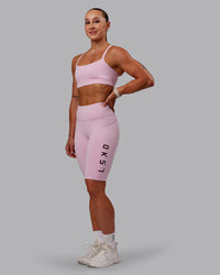 Woman wearing Rep Ultra High-Rise 9" Short Pockets - Marshmallow-Cherry Lacquer