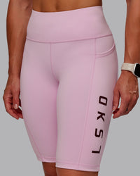 Woman wearing Rep Ultra High-Rise 9" Short Pockets - Marshmallow-Cherry Lacquer