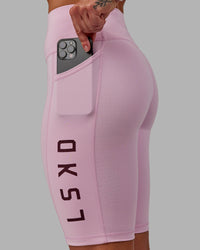 Woman wearing Rep Ultra High-Rise 9" Short Pockets - Marshmallow-Cherry Lacquer