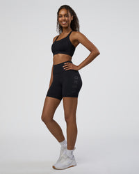 Woman wearing Rep Ultra High-Rise 6" Short Pockets - Black-Black | Model:Jordan | Size:S