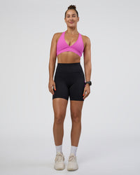 Woman wearing Rep Ultra High-Rise 6" Short Pockets - Black-Ultra Fuchsia | Model:Abbey | Size:S