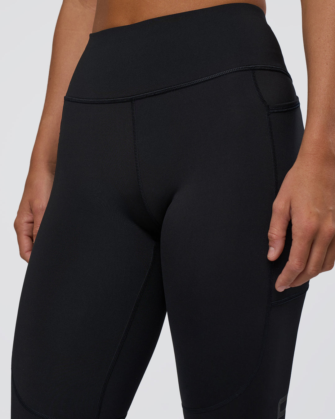 Woman wearing Rep Ultra High-Rise 3/4 Legging Pockets - Black-Black | Model:Amity | Size:S