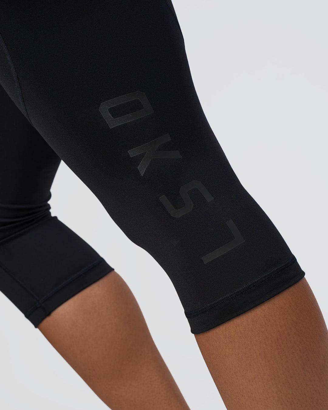 Woman wearing Rep Ultra High-Rise 3/4 Legging Pockets - Black-Black | Model:Amity | Size:S