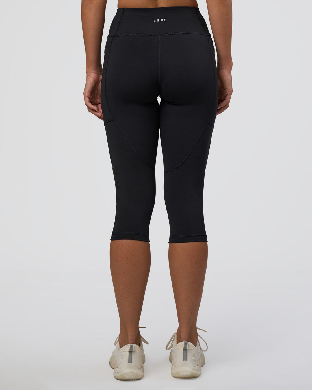 Woman wearing Rep Ultra High-Rise 3/4 Legging Pockets - Black-Black | Model:Amity | Size:S