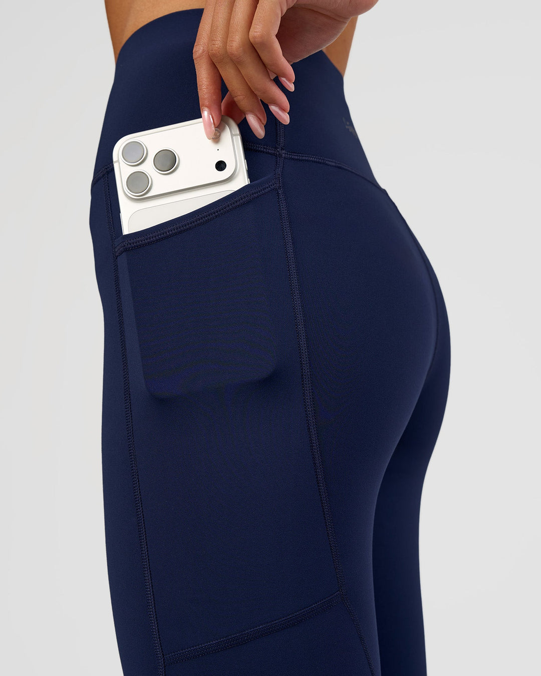 Woman wearing Rep Ultra High-Rise 3/4 Legging Pockets - Future Navy-White | Model:Dakota | Size:S