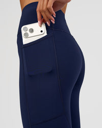 Woman wearing Rep Ultra High-Rise 3/4 Legging Pockets - Future Navy-White | Model:Dakota | Size:S