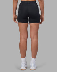 Woman wearing Rep Ultra High-Rise 4" Short Pockets - Black-Blue Atoll | Model:Sophie | Size:S