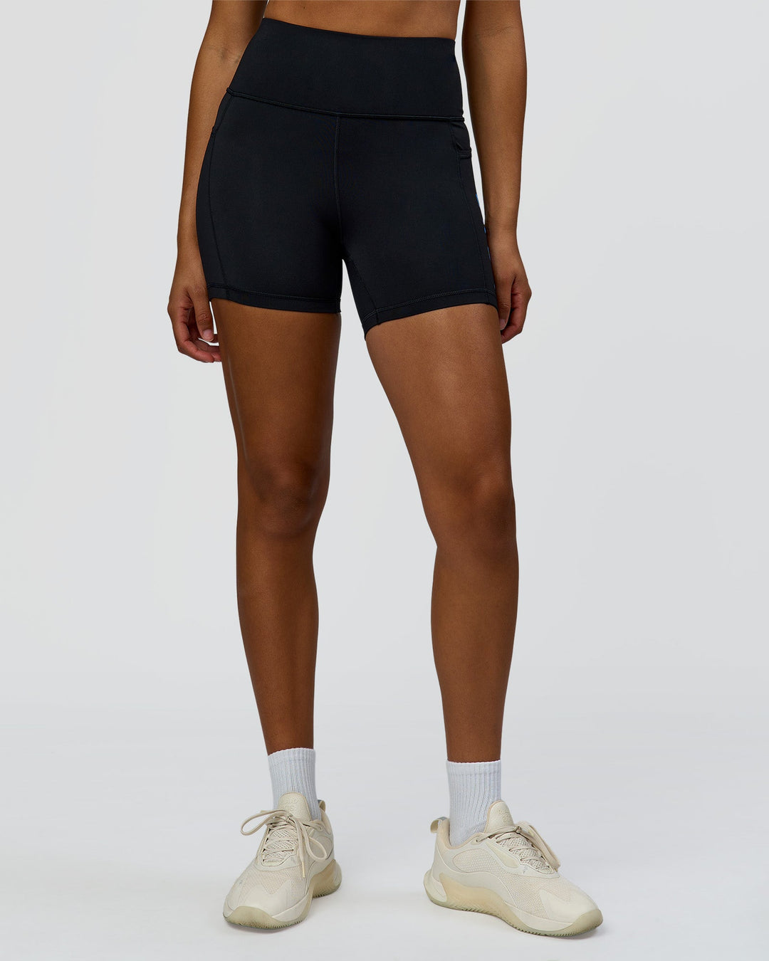 Woman wearing Rep Ultra High-Rise 4" Short Pockets - Black-Palace Blue | Model:Rosie | Size:S
