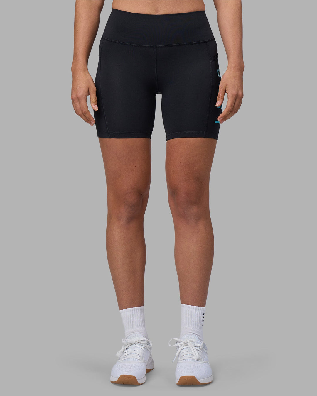 Woman wearing Rep Ultra High-Rise 6" Short Pockets - Black-Blue Atoll | Model:Sophie | Size:S