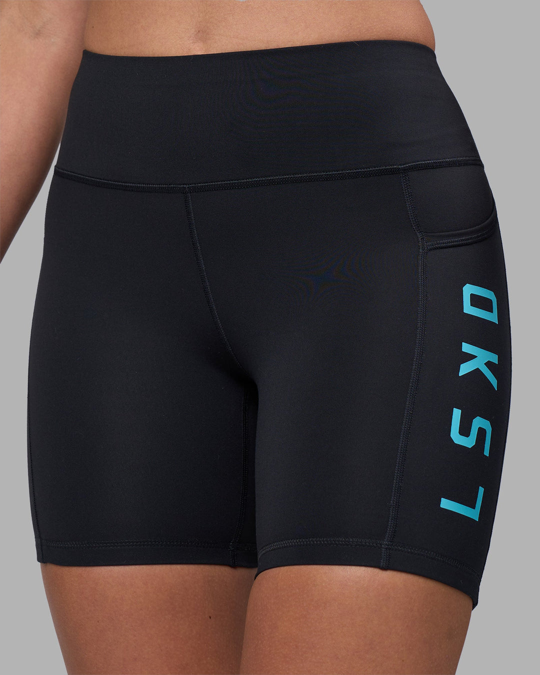 Woman wearing Rep Ultra High-Rise 6" Short Pockets - Black-Blue Atoll | Model:Sophie | Size:S