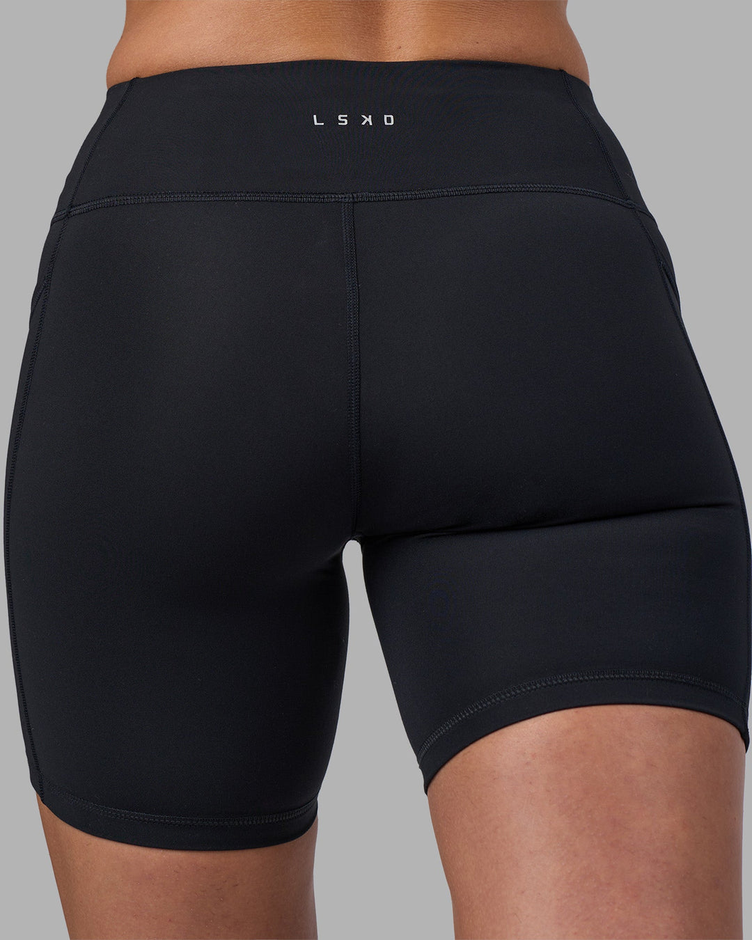 Woman wearing Rep Ultra High-Rise 6" Short Pockets - Black-Blue Atoll | Model:Sophie | Size:S