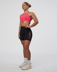 Woman wearing Rep Ultra High-Rise 6" Short Pockets - Black-Bright Raspberry | Model:Tenaya | Size:S