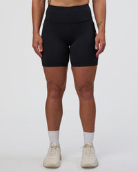 Woman wearing Rep Ultra High-Rise 6" Short Pockets - Black-Bright Raspberry | Model:Tenaya | Size:S