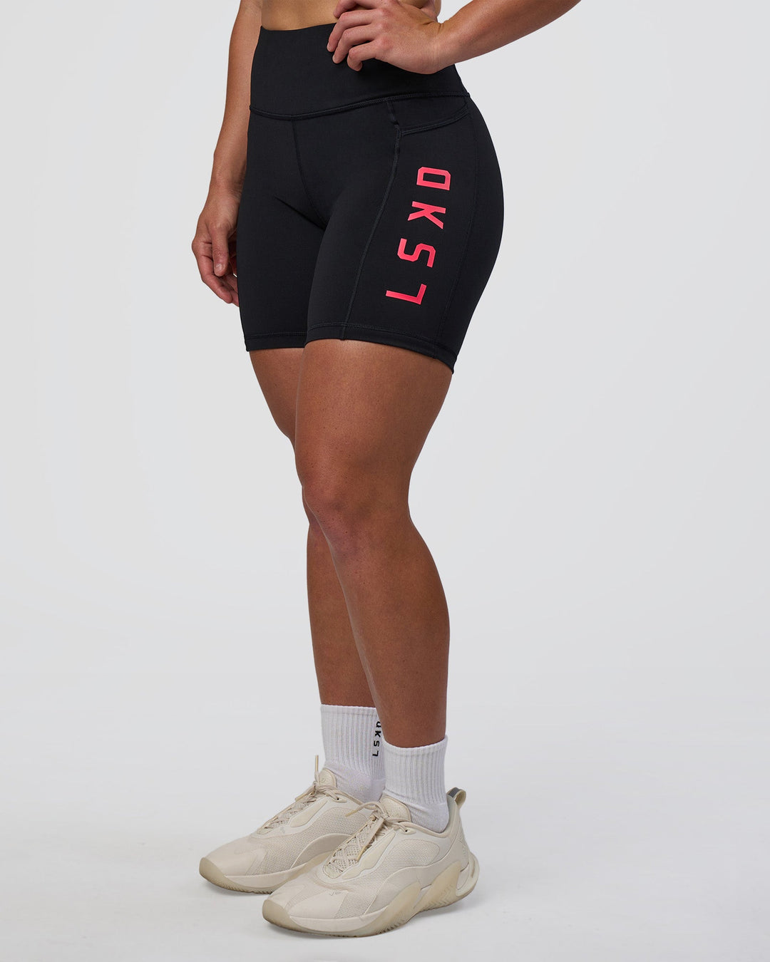 Woman wearing Rep Ultra High-Rise 6" Short Pockets - Black-Bright Raspberry | Model:Tenaya | Size:S