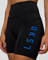 Woman wearing Rep Ultra High-Rise 6" Short Pockets - Black-Electric Indigo | Model:Evie | Size:S