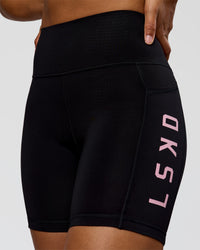 Woman wearing Rep Ultra High-Rise 6" Short Pockets - Black-Marshmallow | Model:Rosie | Size:S