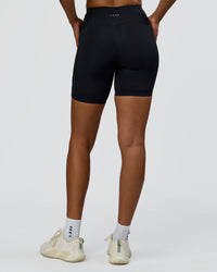 Woman wearing Rep Ultra High-Rise 6" Short Pockets - Black-Palace Blue | Model:Rosie | Size:S