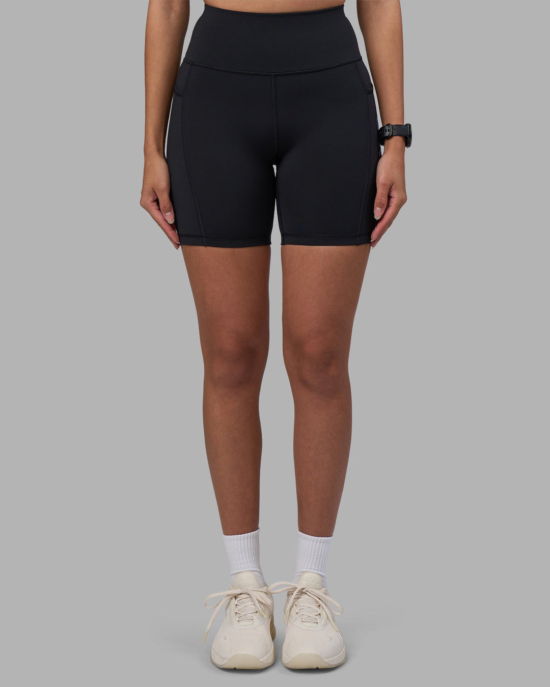 Woman wearing Rep Ultra High-Rise 6&quot; Short Pockets - Black-Power Cobalt | Model:Rhiley | Size:S