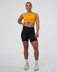 Woman wearing Rep Ultra High-Rise 6" Short Pockets - Black-Zinnia | Model:Tenaya | Size:S