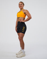 Woman wearing Rep Ultra High-Rise 6" Short Pockets - Black-Zinnia | Model:Tenaya | Size:S