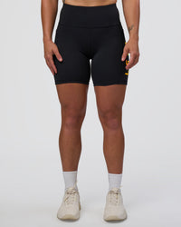 Woman wearing Rep Ultra High-Rise 6" Short Pockets - Black-Zinnia | Model:Tenaya | Size:S