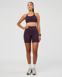 Woman wearing Rep Ultra High-Rise 6" Short Pockets - Midnight Plum-Marshmallow | Model:Rhiley | Size:S