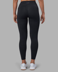 Woman wearing Rep Ultra High-Rise 7/8 Legging Pockets - Black-Blue Atoll | Model:Sophie | Size:S