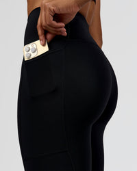 Woman wearing Rep Ultra High-Rise 7/8 Legging Pockets - Black-Marshmallow | Model:Rosie | Size:S