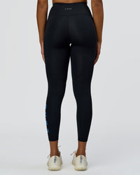 Woman wearing Rep Ultra High-Rise 7/8 Legging Pockets - Black-Palace Blue | Model:Rosie | Size:S
