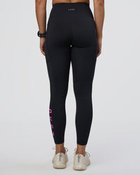 Woman wearing Rep Ultra High-Rise 7/8 Legging Pockets - Black-Ultra Fuchsia | Model:Abbey | Size:S