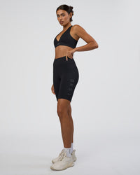 Woman wearing Rep Ultra High-Rise 9" Short Pockets - Black-Black | Model:Ruby | Size:S