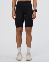 Woman wearing Rep Ultra High-Rise 9" Short Pockets - Black-Ultra Fuchsia | Model:Abbey | Size:S