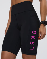 Woman wearing Rep Ultra High-Rise 9" Short Pockets - Black-Ultra Fuchsia | Model:Abbey | Size:S