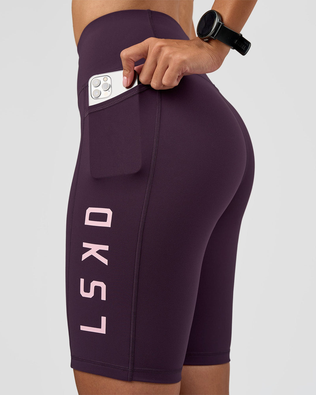 Woman wearing Rep Ultra High-Rise 9" Short Pockets - Midnight Plum-Marshmallow | Model:Rhiley | Size:S