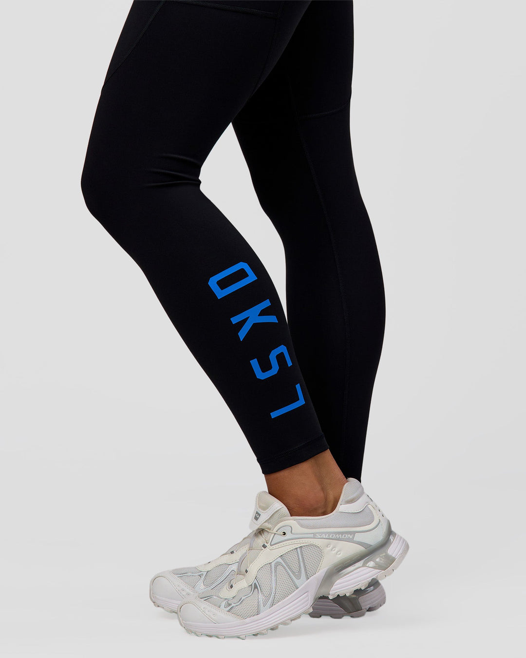 Woman wearing Rep Ultra High-Rise Full Length Legging Pockets - Black-Palace Blue | Model:Amity | Size:S