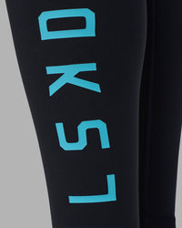 Woman wearing Rep Ultra High-Rise Full Length Legging Pockets - Black-Blue Atoll | Model:Sophie | Size:S