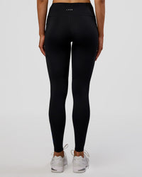 Woman wearing Rep Ultra High-Rise Full Length Legging Pockets - Black-Electric Indigo | Model:Evie | Size:S
