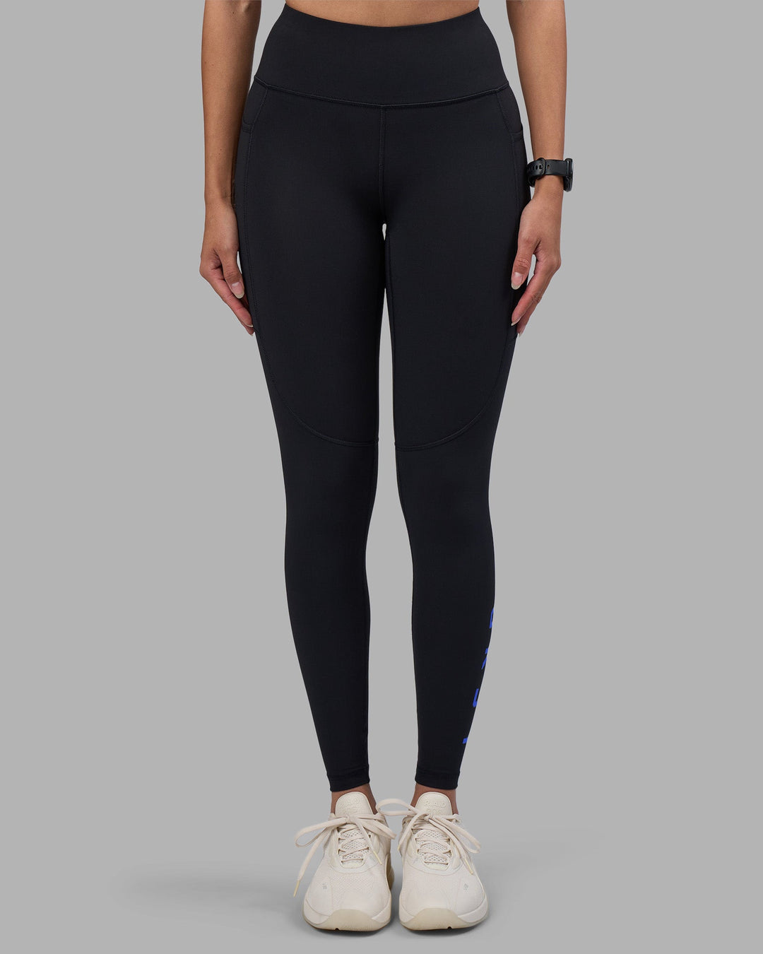 Woman wearing Rep Ultra High-Rise Full Length Legging Pockets - Black-Power Cobalt | Model:Rhiley | Size:S