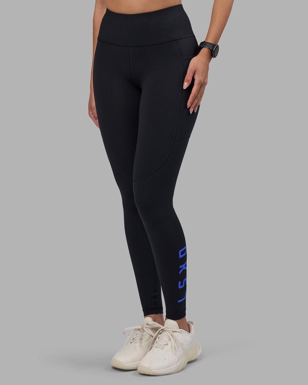 Woman wearing Rep Ultra High-Rise Full Length Legging Pockets - Black-Power Cobalt | Model:Rhiley | Size:S