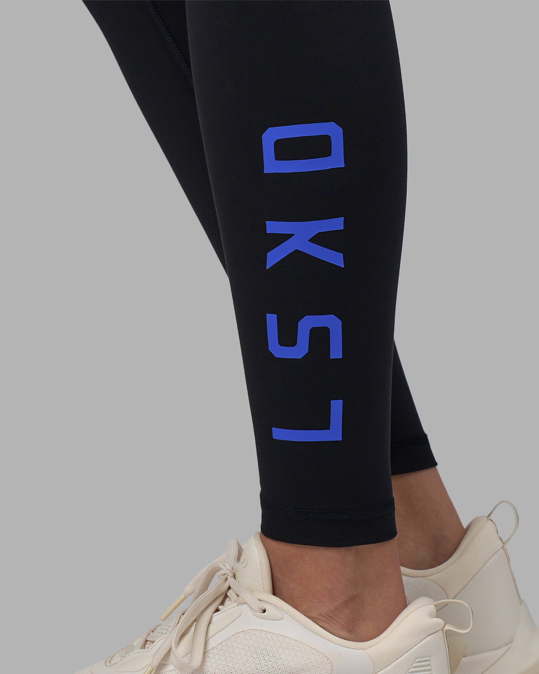 Woman wearing Rep Ultra High-Rise Full Length Legging Pockets - Black-Power Cobalt | Model:Rhiley | Size:S